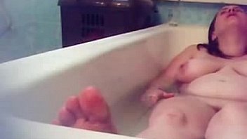 Hidden cam. My horny mum fingering in bath tube